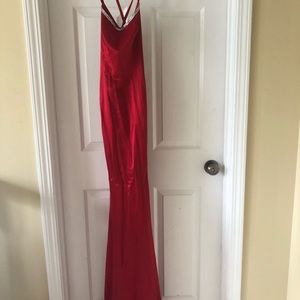 Red silk dress with open back and tie, also had red silk train